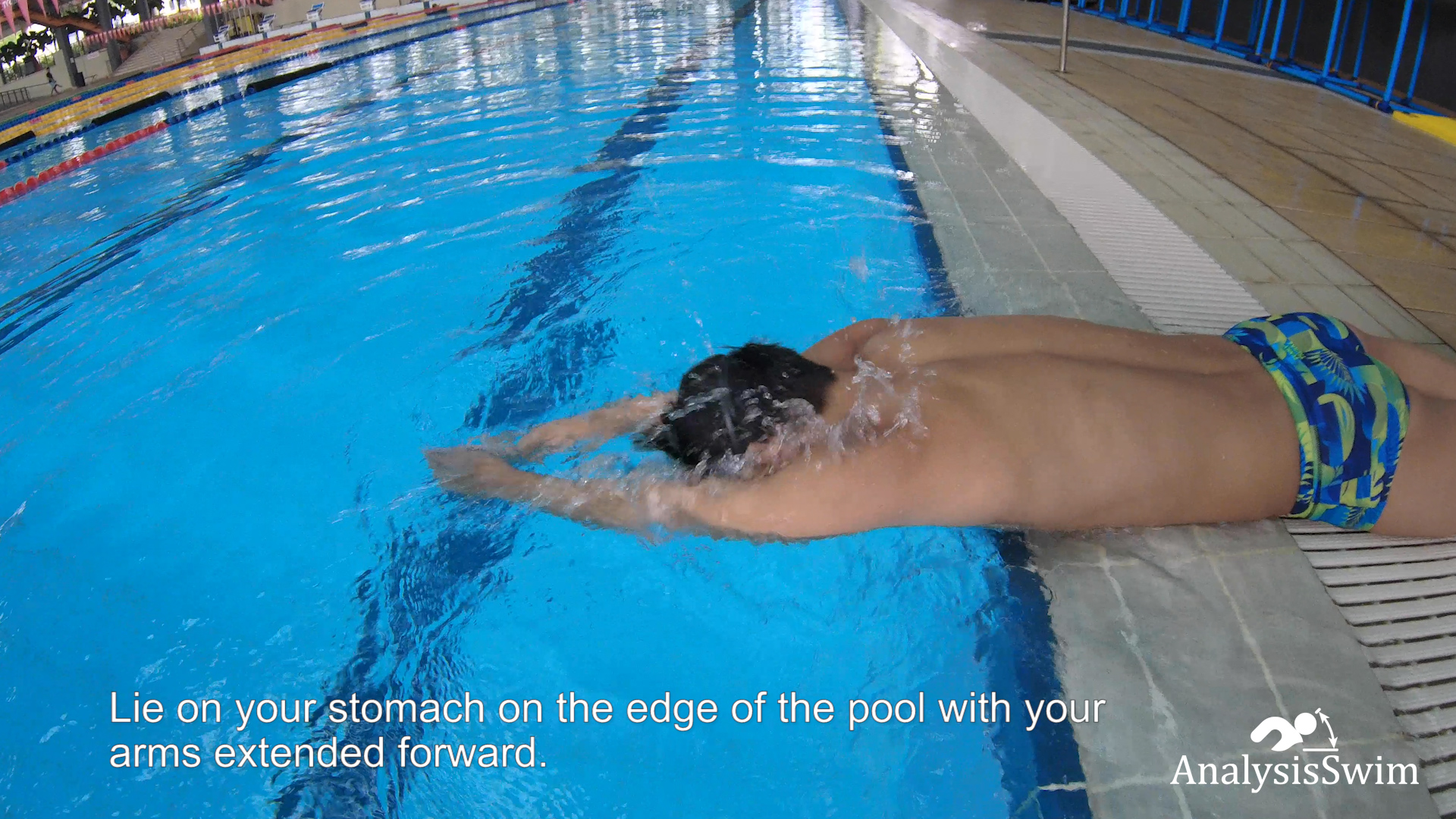 Breaststroke pull while lying down on the edge of the pool